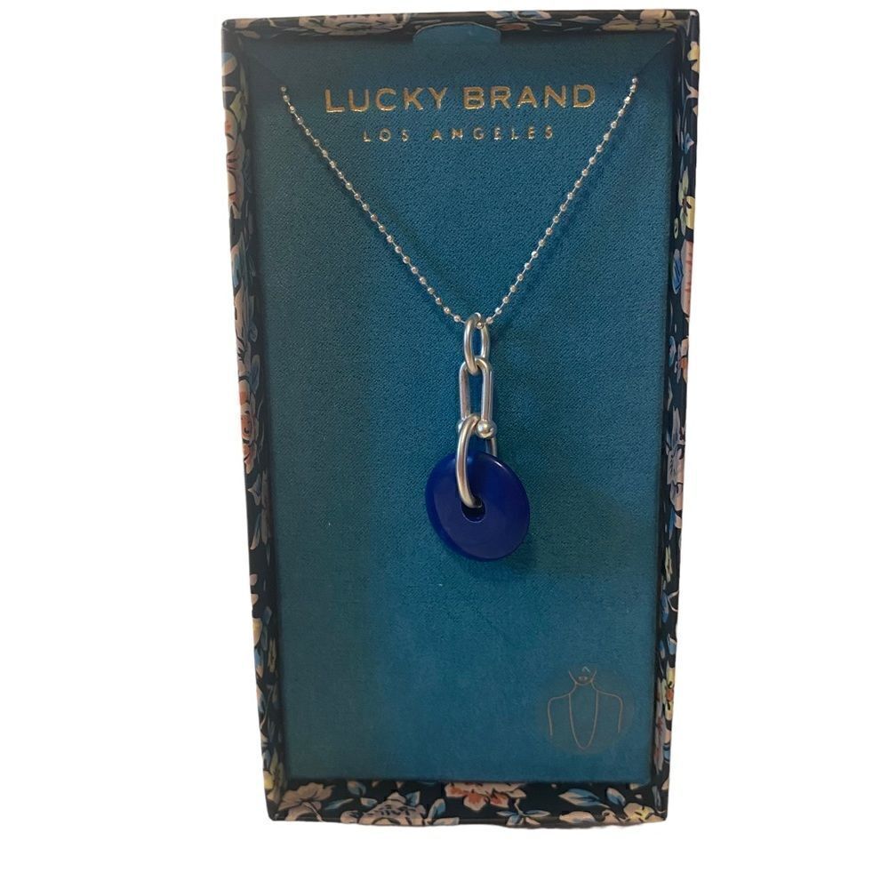 Lucky Brand Blue Circular Stone Pendant on long silver toned chain.